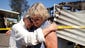 Nola Rawlins 83, hugs neighbor Jean Crawford, right, after looking at her home which was destroyed by a fire at the Napa Valley mobile home park after a magnitude-6.0 earthquake in Napa, Calif.