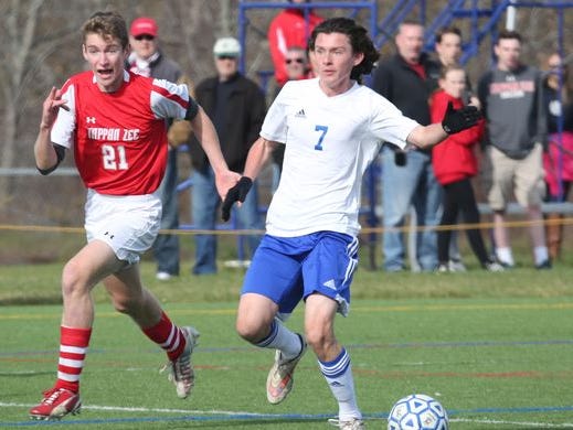 Craig MacDonald (right) dribbles the ball as Pearl River beat Tappan Zee, 3-0 in the Section 1 Class A boys final at Arlington High School, Oct. 31, 2015.