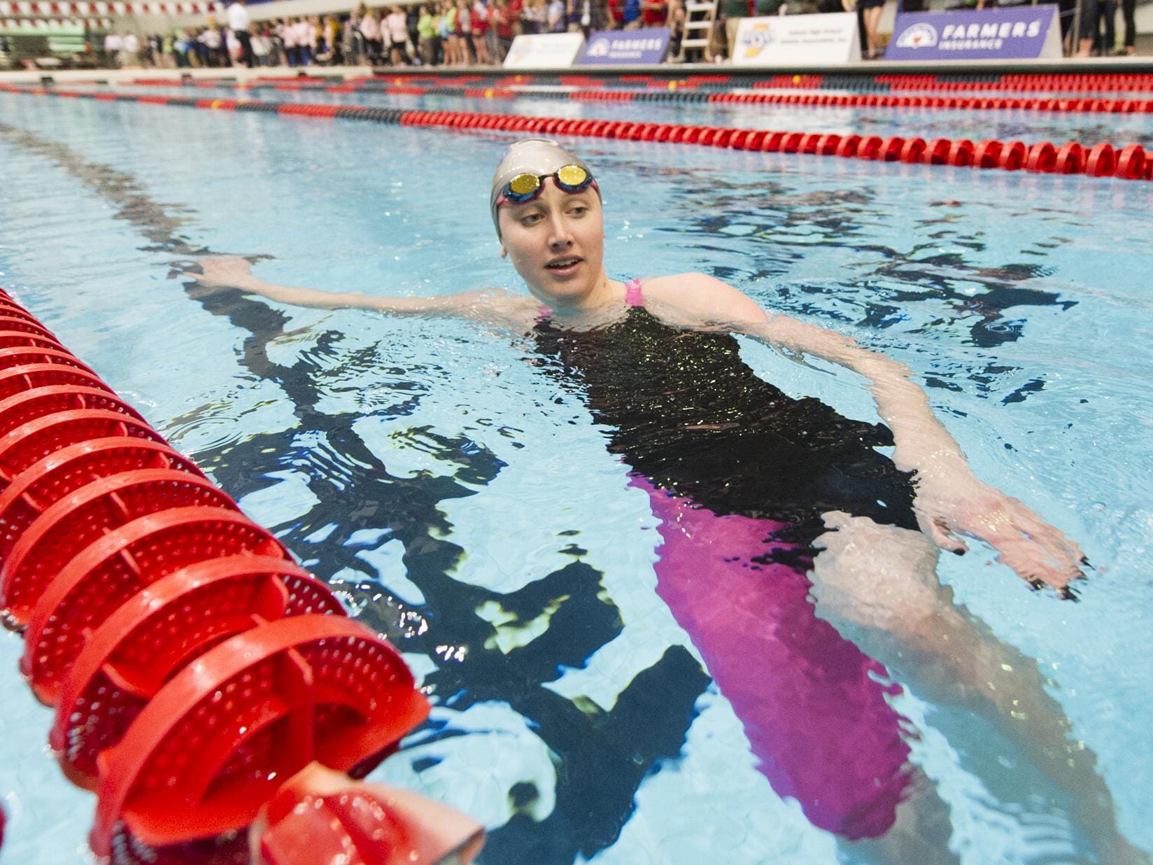Carmel's Amy Bilquist cools down in the pool after winning the 100 Yard Freestyle event at 41st Annual IHSAA Girl's Swimming and Diving State Finals, Feb. 14, 2015, at IUPUI Natatorium in Indianapolis.
