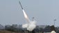 A missile is launched from the southern Israeli city of Ashdod by the "Iron Dome" missile-defense system that is designed to intercept and destroy incoming short-range rockets and artillery shells.