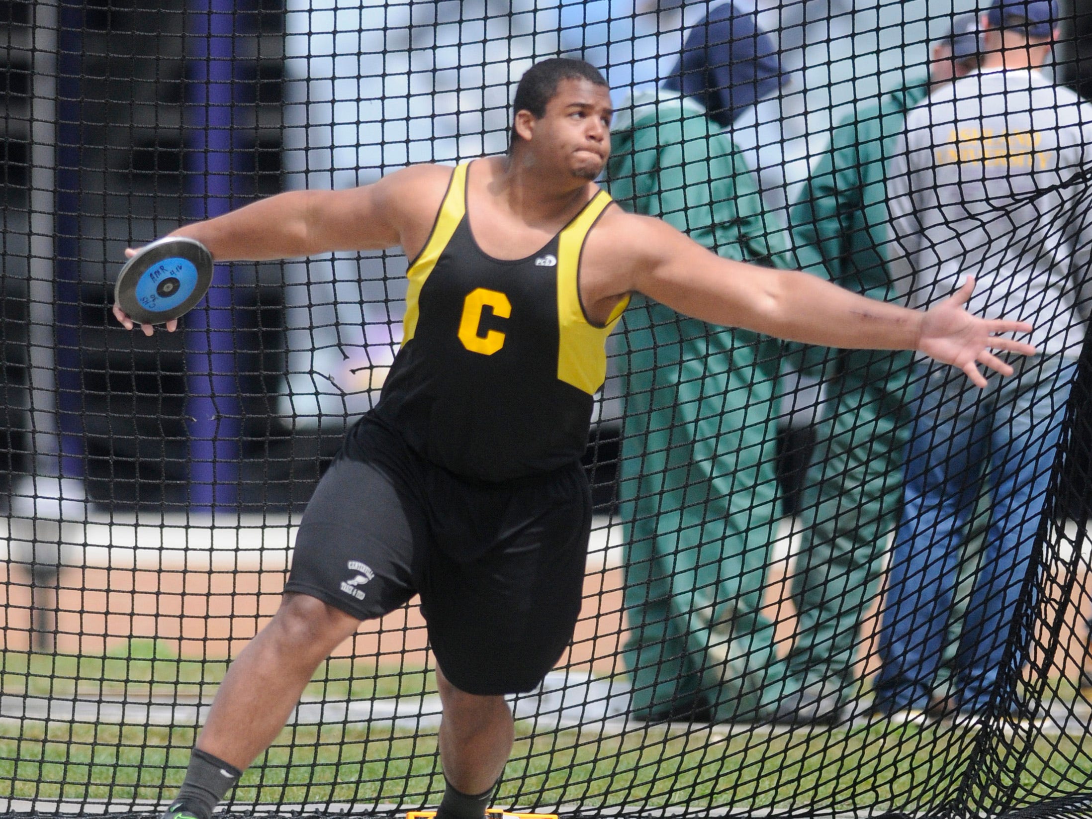 Centerville’s Michael Bennett, one of the stars on Ohio State’s national championship football team, competes in the discus finals at the 2011 Mehock Relays.