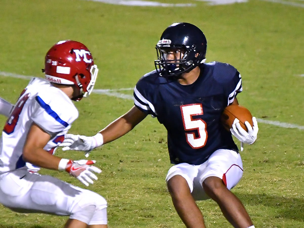 Creek Wood running back Daniel Davila cuts inside for a short gain against Montgomery Central.