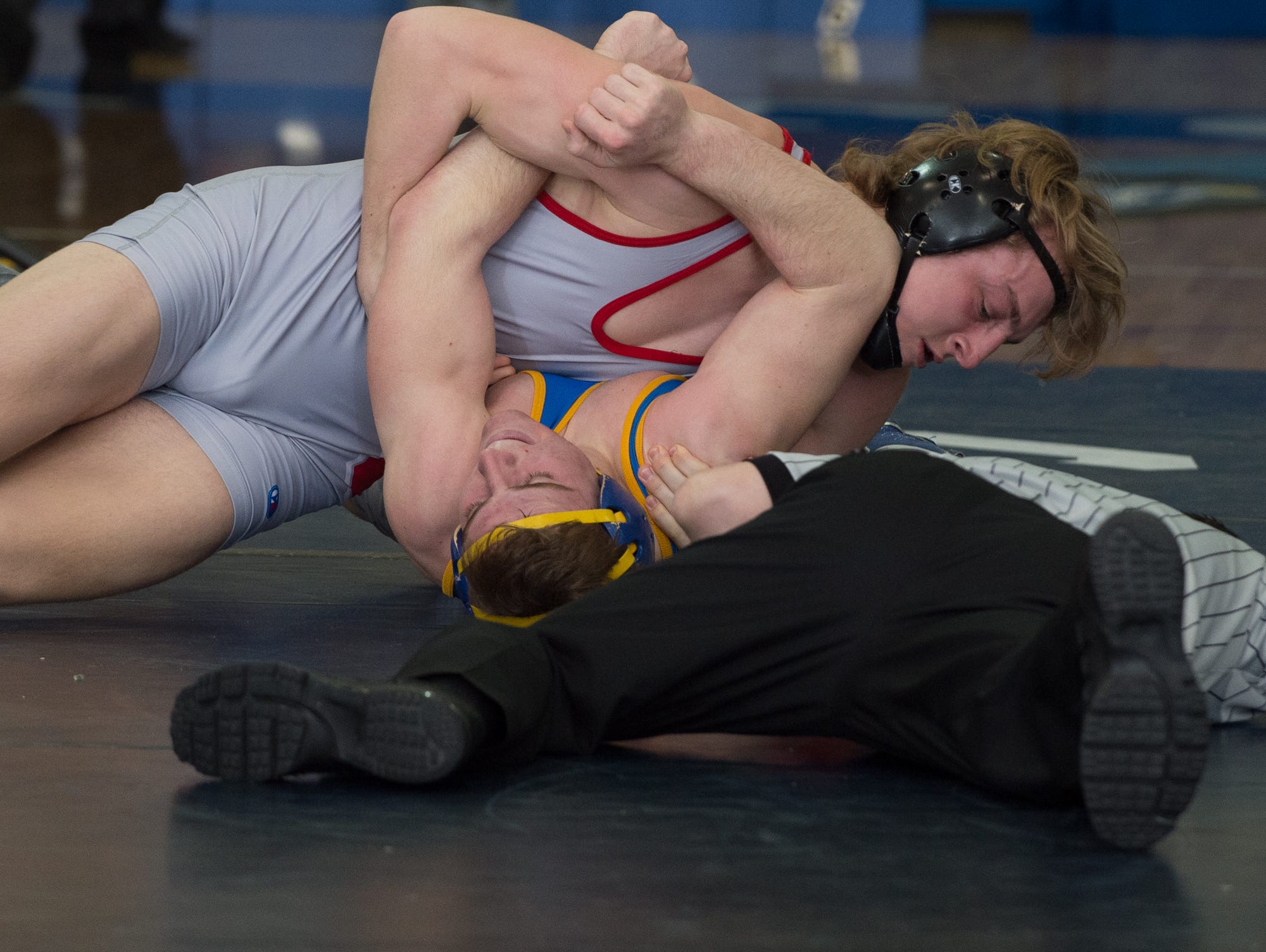 Smyrna's Anthony Wuest pins Michael Clavier in the 195 pound final match at the Henlopen Conference wrestling championships at Dover High School.