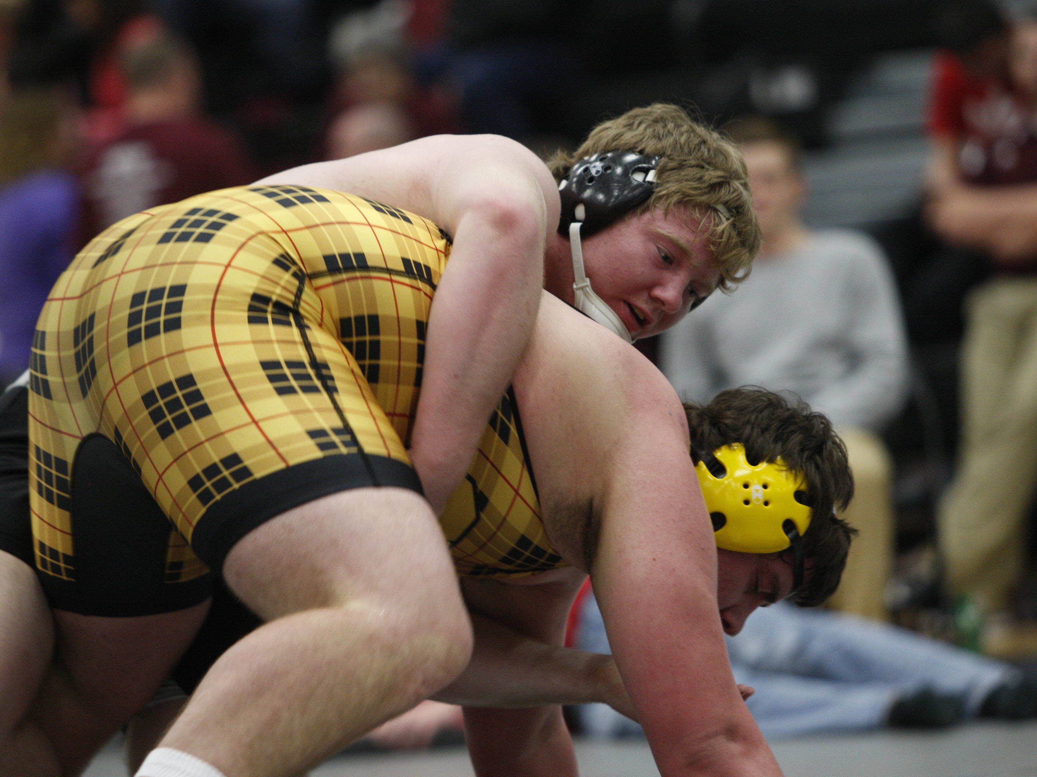 Ankeny Centennial's Collin Olson controls Jake Marnin of Southeast Polk during the 285-pound final in a Class 3-A district tournament on Saturday at Centennial. Olson dropped a 3-0 decision, but still advanced to the state tournament.