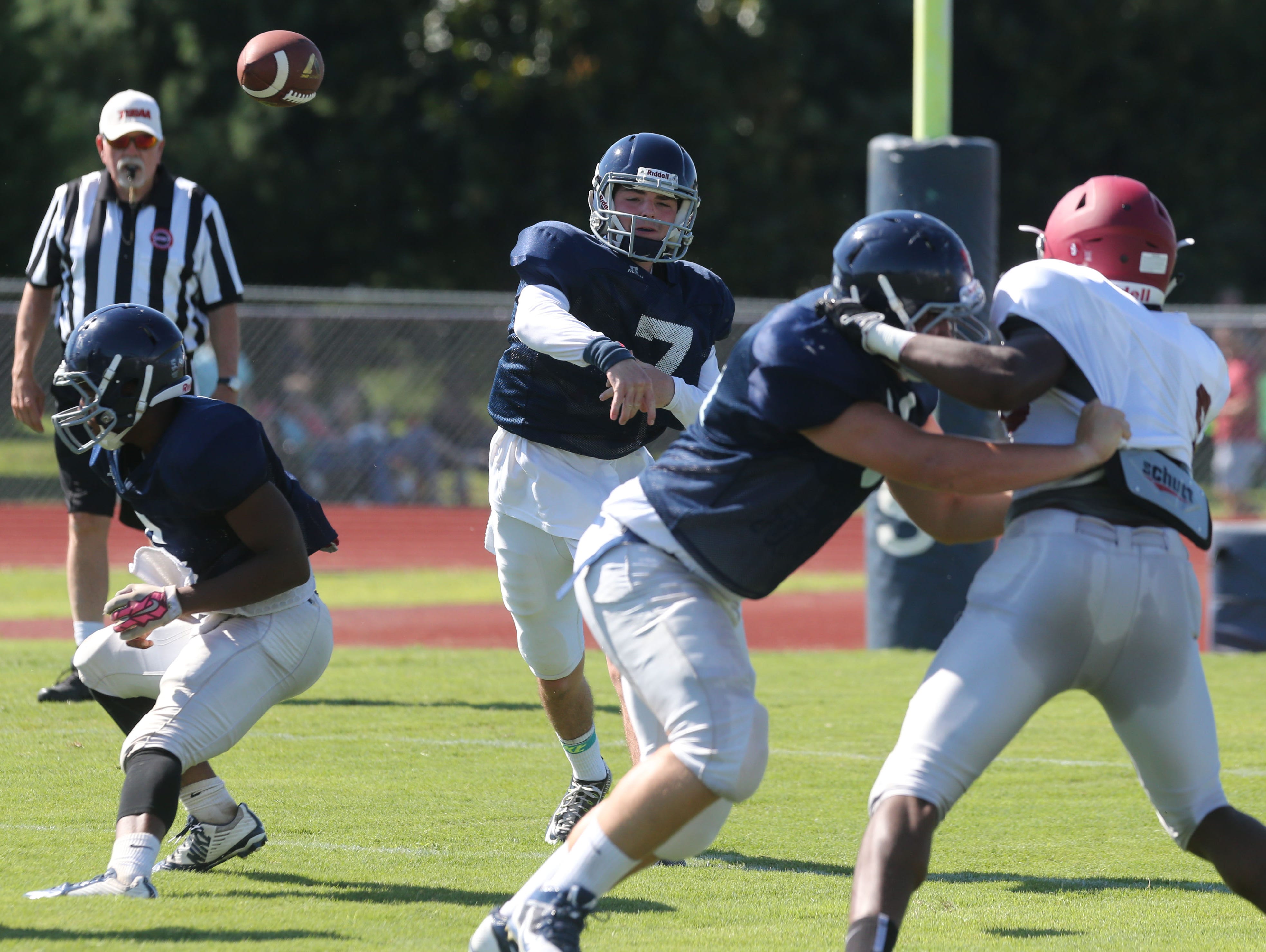 Siegel's Jordan Middleton throws a pass against MBA on Friday.