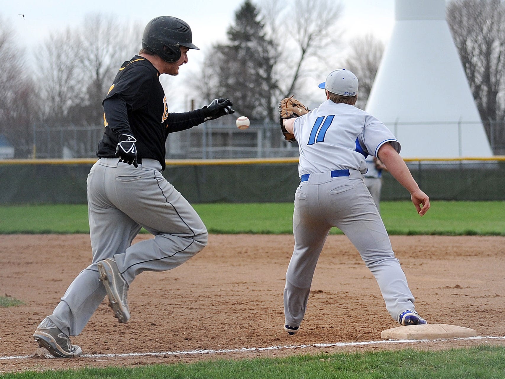 Wynford’s Caleb Stone makes a catch and gets Colonel Crawford’s Dylan Burkhart out during a game Tuesday evening.