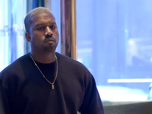 Singer Kanye West arrives at Trump Tower December 13,