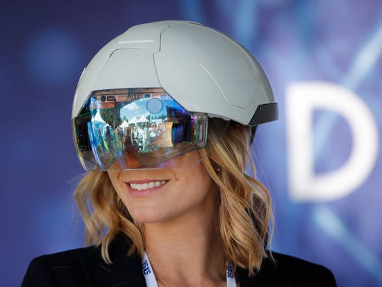 A woman at a White House event this month demos a helmet
