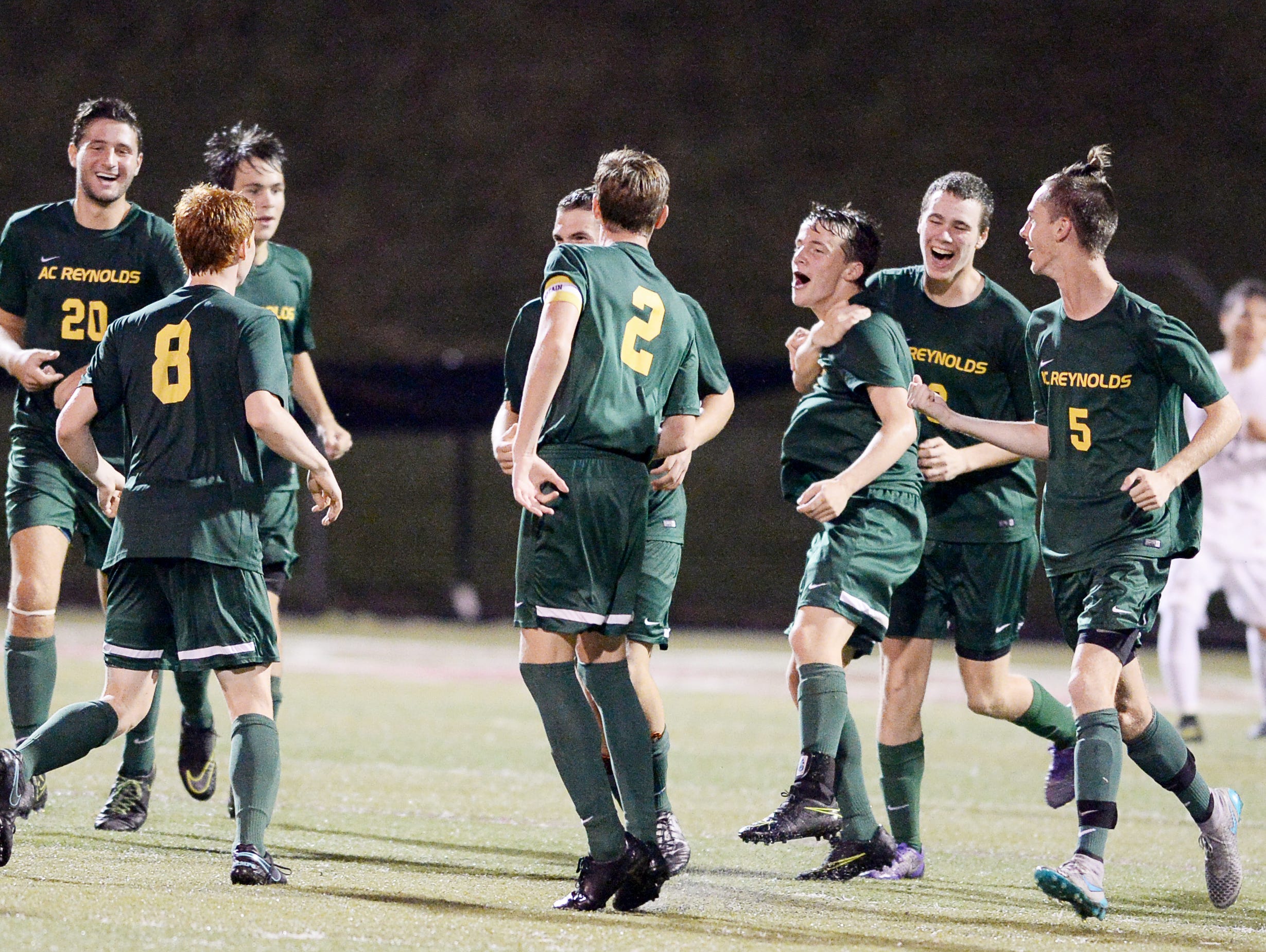 The Reynolds soccer team celebrates after Matthew Kennedy scored a goal at Asheville September 14, 2016.