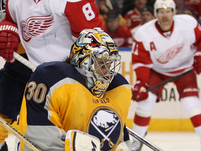 Buffalo Sabres goalie Ryan Miller (30) makes a save during the third period against the Detroit Red Wings at First Niagara Center. Detroit beats Buffalo 3 to 1.