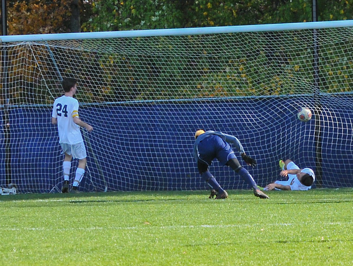 East Lansing scores the game-winning goal against DeWitt in the D2 District Final Saturday, October 22, 2016. East Lansing won 2-1.