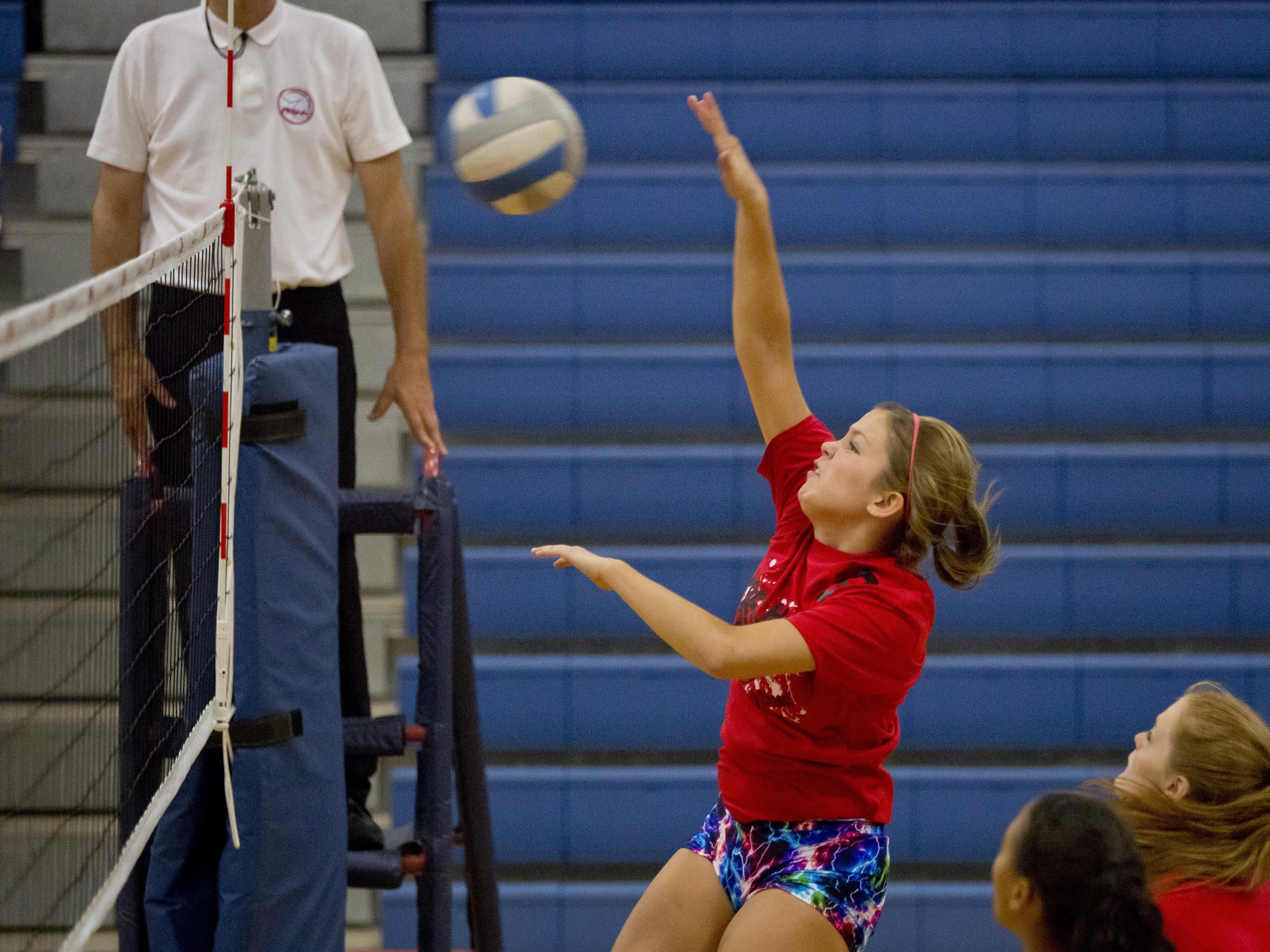 Port Huron's Brittany Goodwin spikes the ball during the Pioneer Volleyball Invitational Saturday, September 12, 2015 at Cros-Lex High School.
