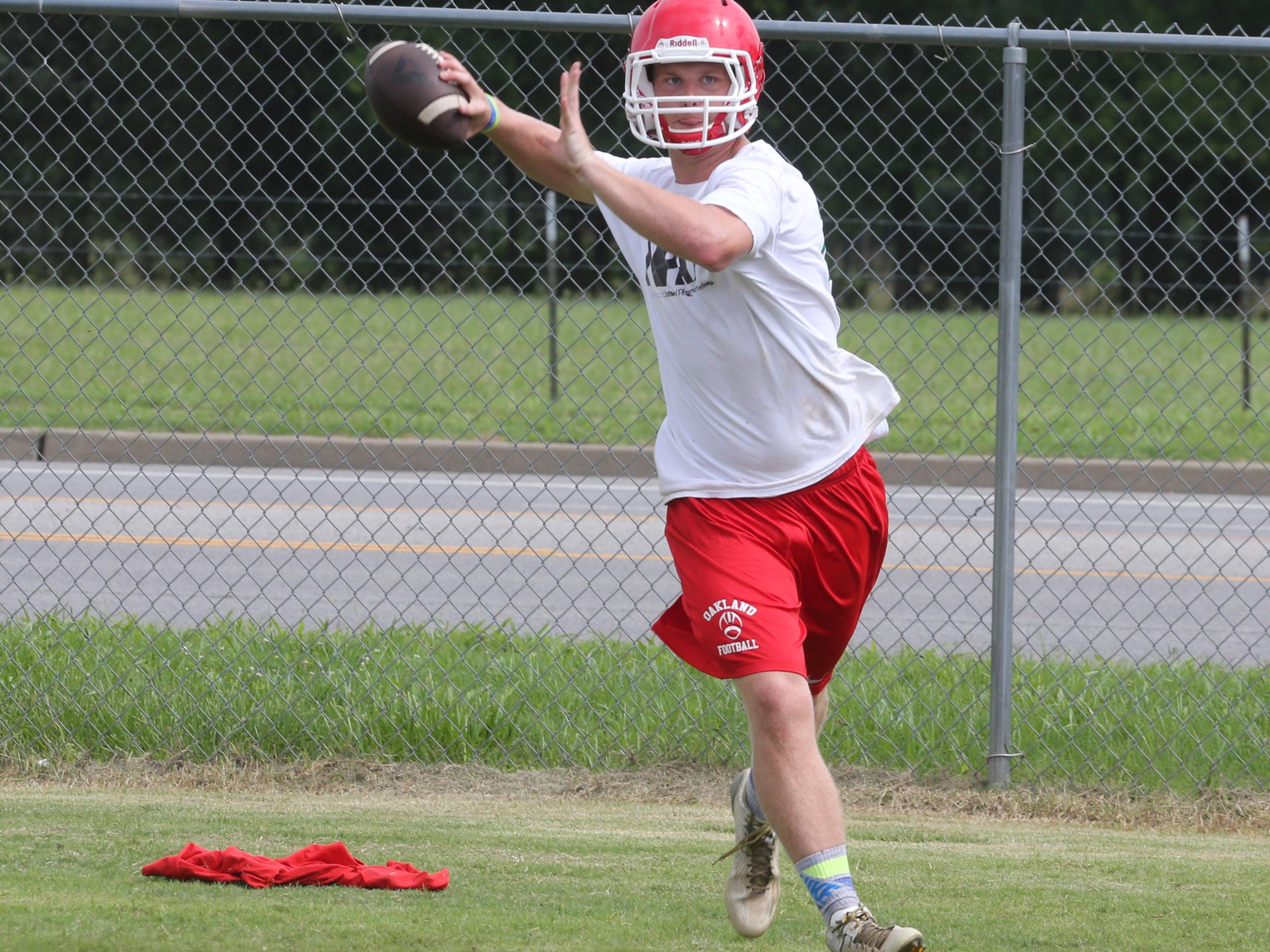 Oakland junior Brendan Matthews, an Independence transfer, is competing with Cody Miller for the starting quarterback position.