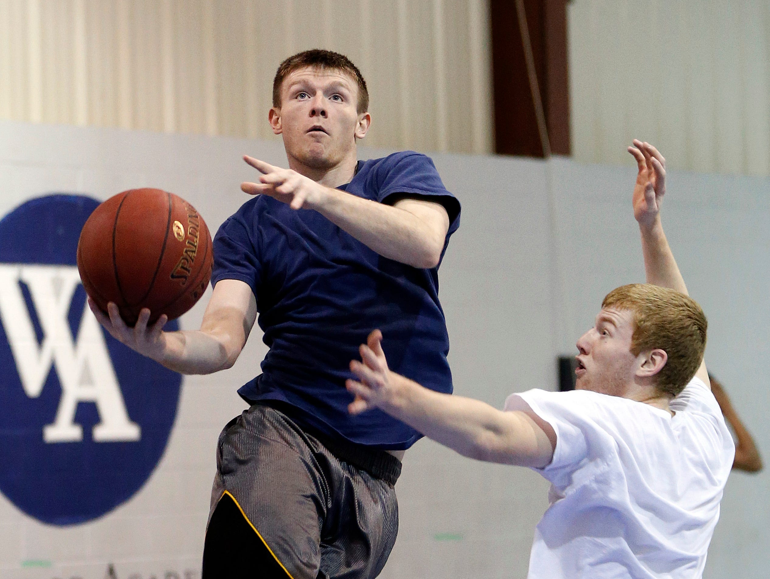 Woodward Academy senior guard Preston Brittain puts up a shot during basketball practice last week. The Knights have qualified for the Class 2-A state boys’ basketball tournament, and they’ll play top-seeded Aplington-Parkersburg in a quarterfinal game at 8:15 p.m. Monday at Wells Fargo Arena.