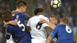 Leicester City and Swansea City fight for the ball