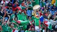 Fans cheer for the Mexican team against New Zealand