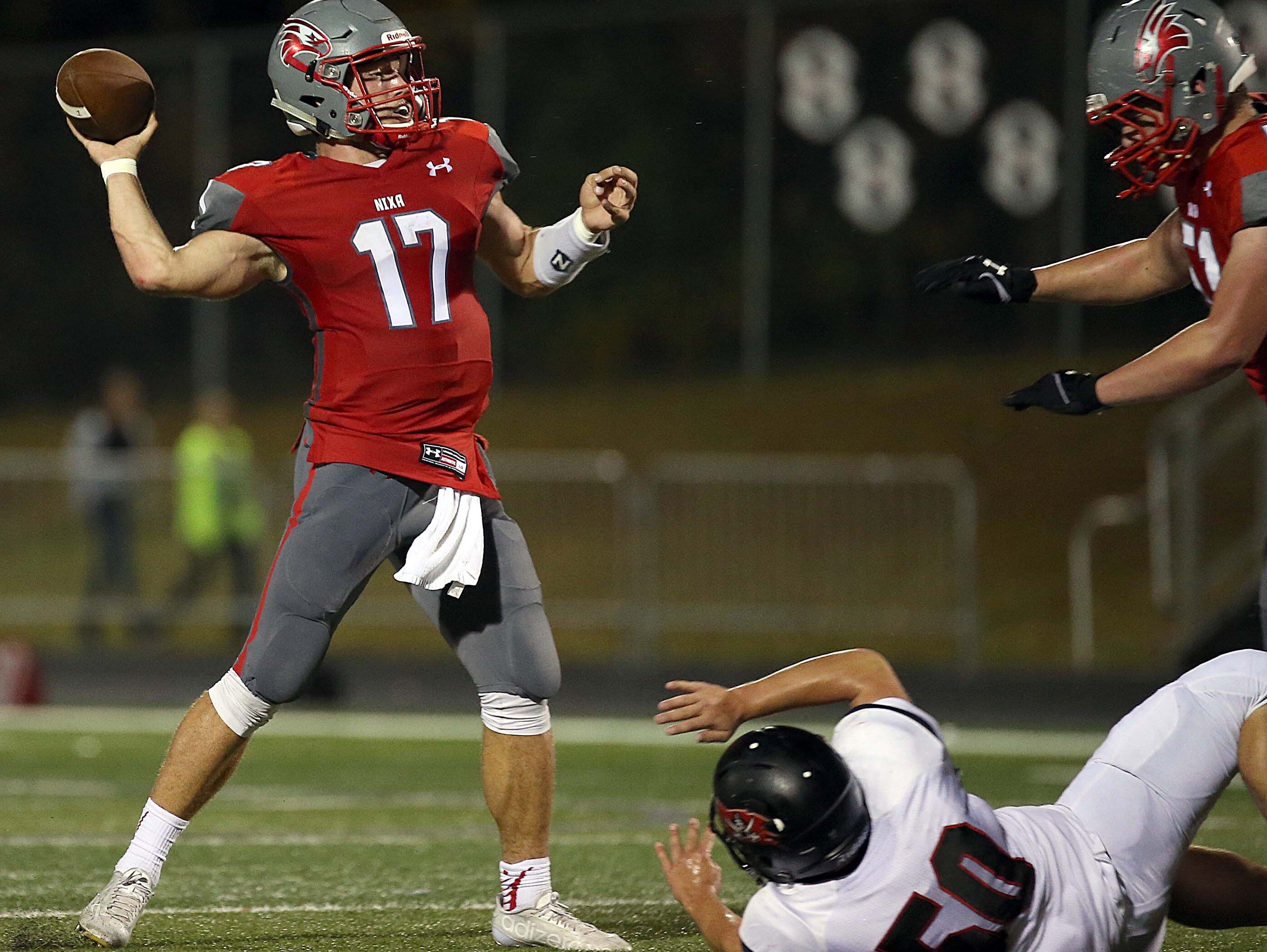 Nixa's Logan Tyler makes a throw down field against visiting Branson on October 23, 2015.