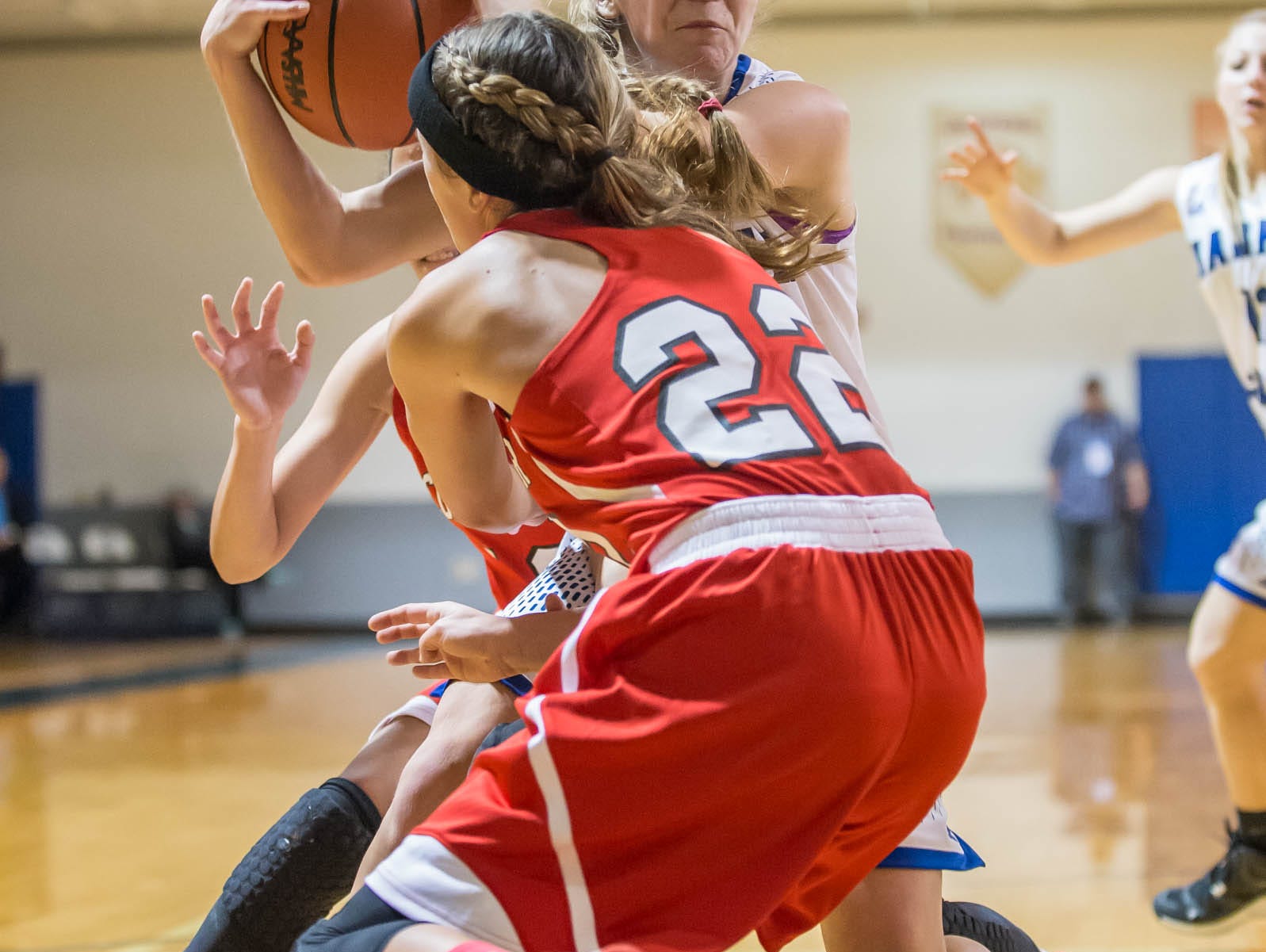 Harper Creek's Macy Hancock drives down the court against Coldwater in Friday evening's game.
