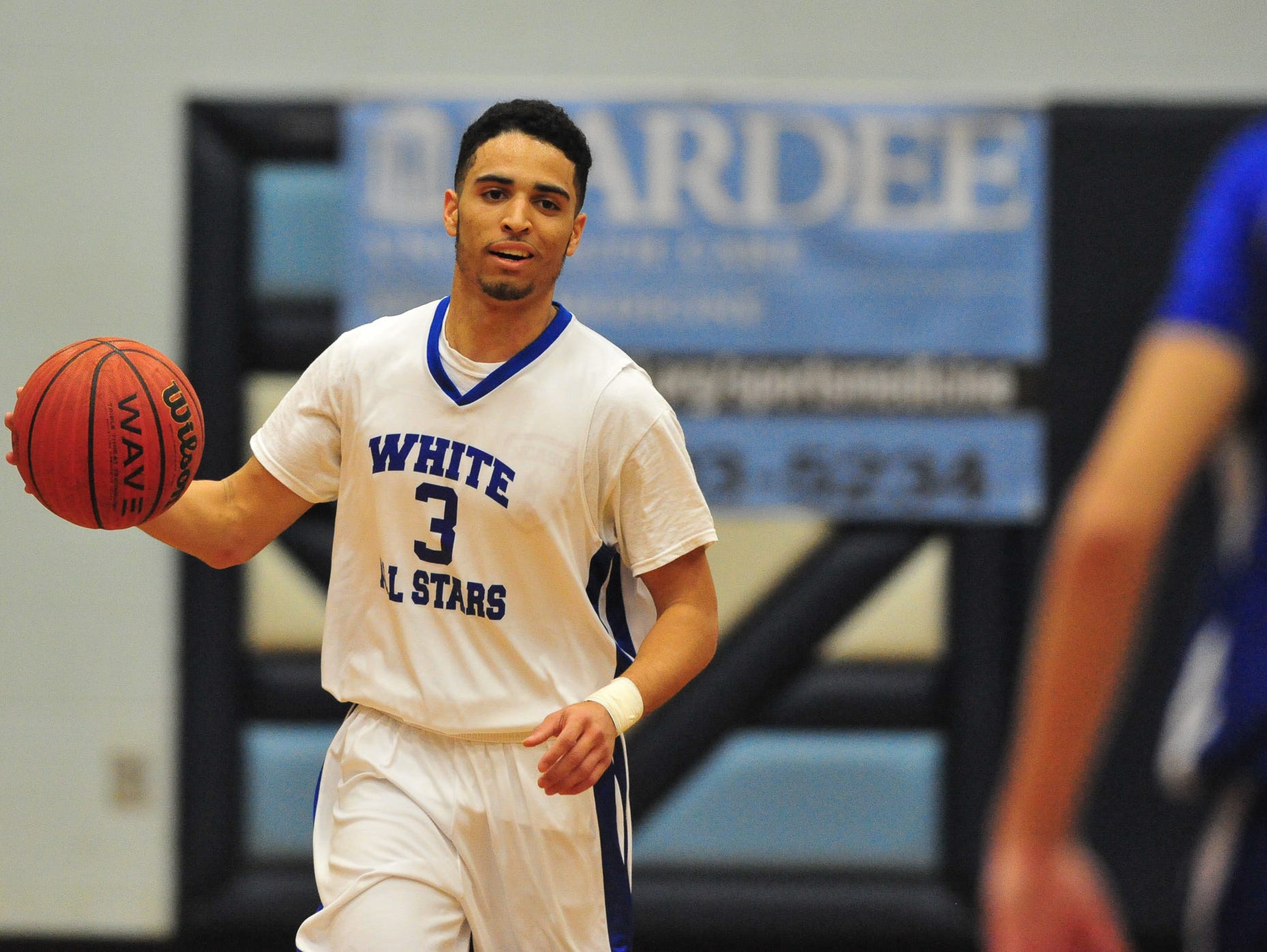 Asheville High senior Damon Scott (3) was the MVP of Saturday night's Blue-White All-Star boys basketball game at Enka.
