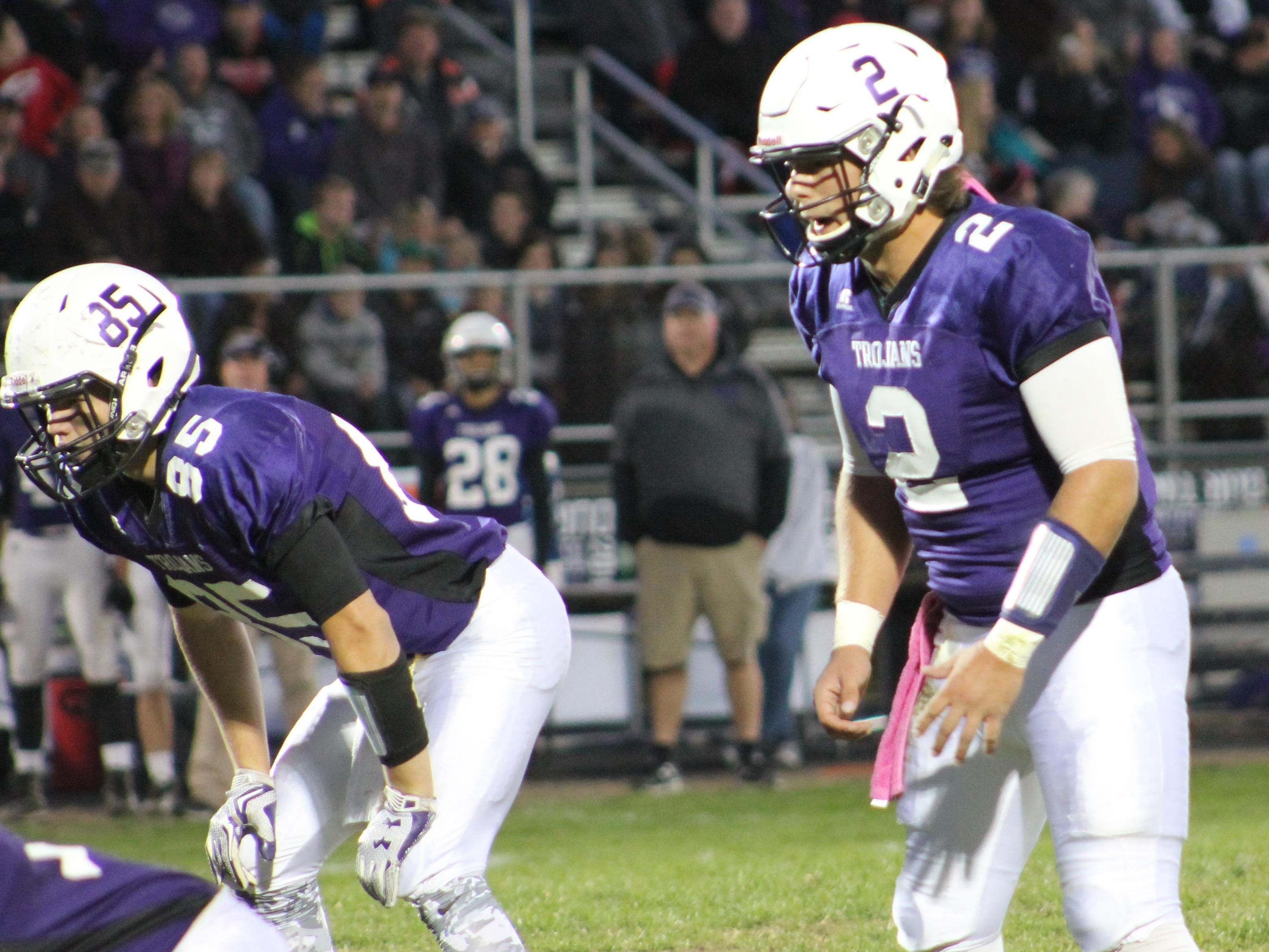 Senior quarterback Tyler Pilcher (2) awaits the snap for the Trojans against Anderson Oct. 16.