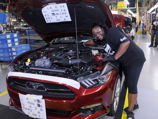 Latrice Young inspects a 2015 Mustang GT at Ford’s Flat Rock Assembly Plant on August 28, 2014.(Photo: Detroit News file)