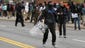 A protester holds a Baltimore Police shield outside