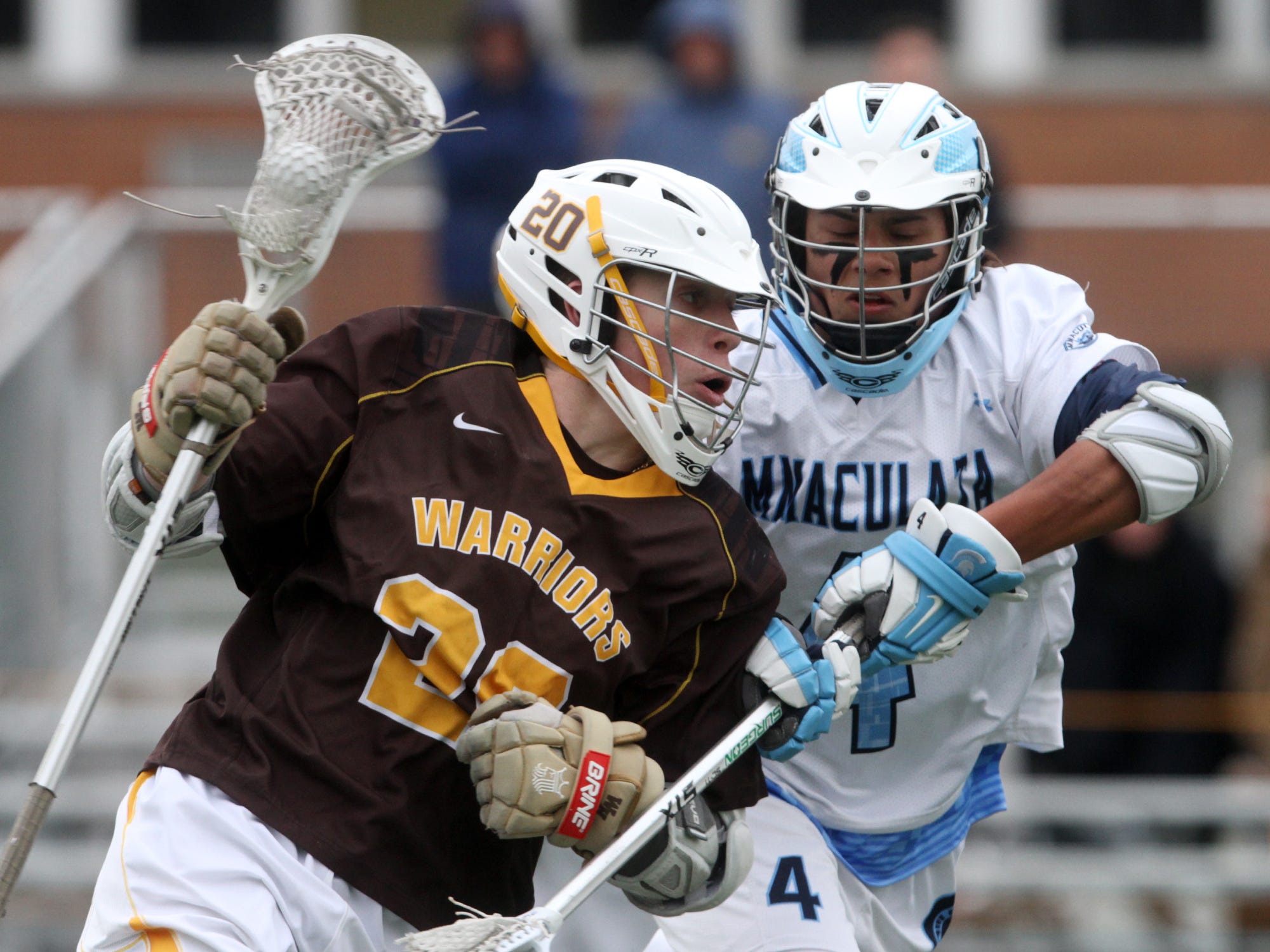 Watchung Hills' John Tekin (20) drives on Immaculata's Alex Hofmann (4), Wednesday, April 8, 2015, in Somerville, NJ.