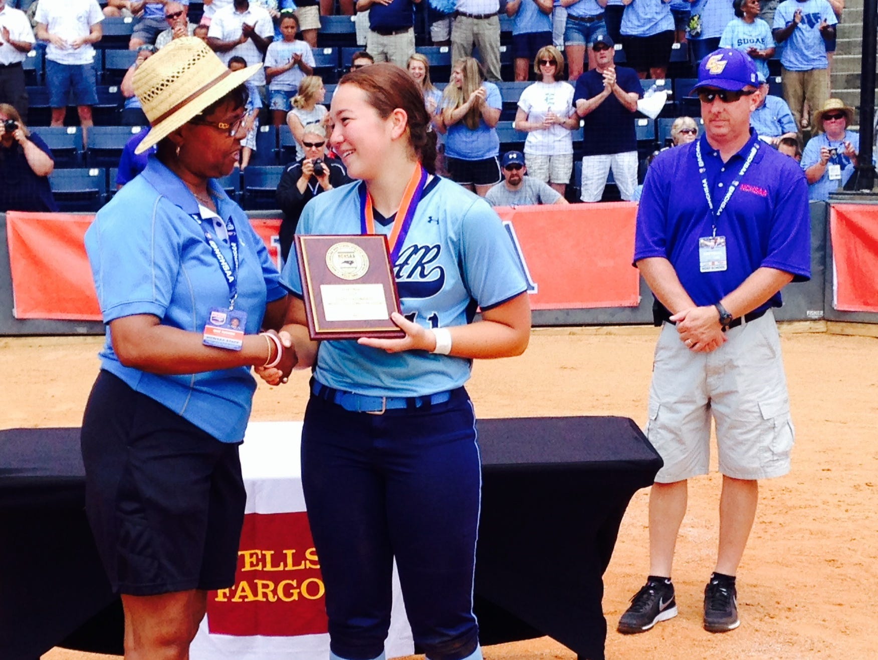 Enka catcher Jordan Harris, pictured here with NCHSAA commissioner Que Tucker, is the Citizen-Times All-WNC Softball Player of the Year.
