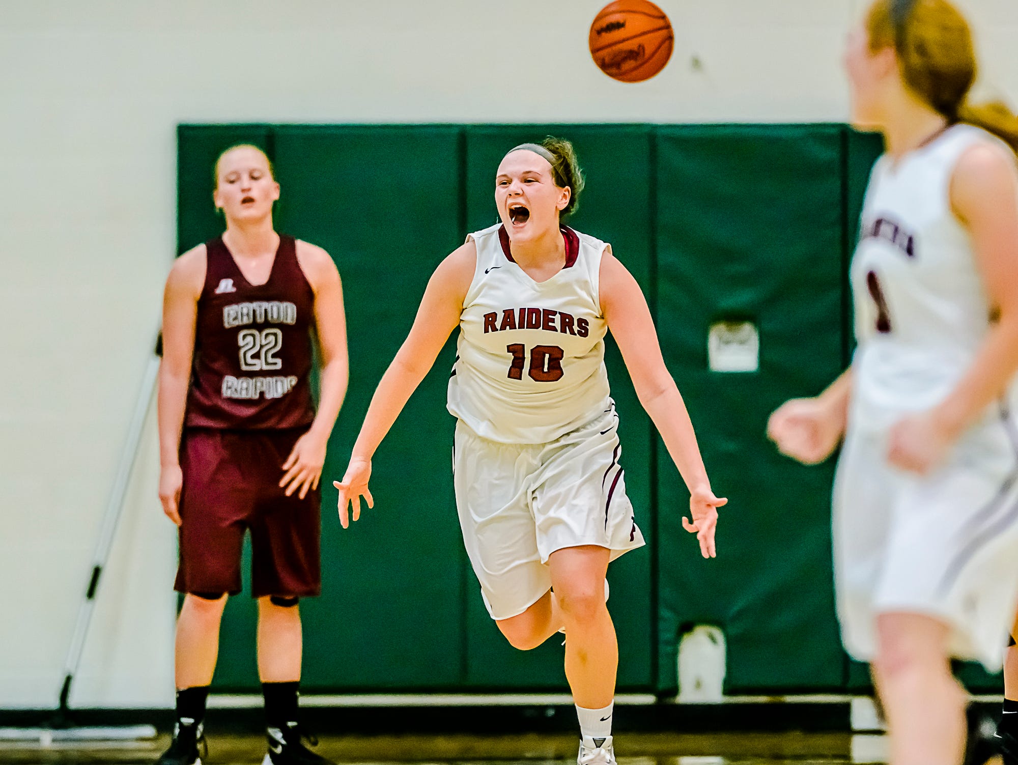 Olivia Roe of Portland celebrates as time expires in the Raiders' overtime defeat of Eaton Rapids in their Class B regional semifinal game Tuesday March 8, 2016 at Wayland Union High in Wayland. KEVIN W. FOWLER PHOTO