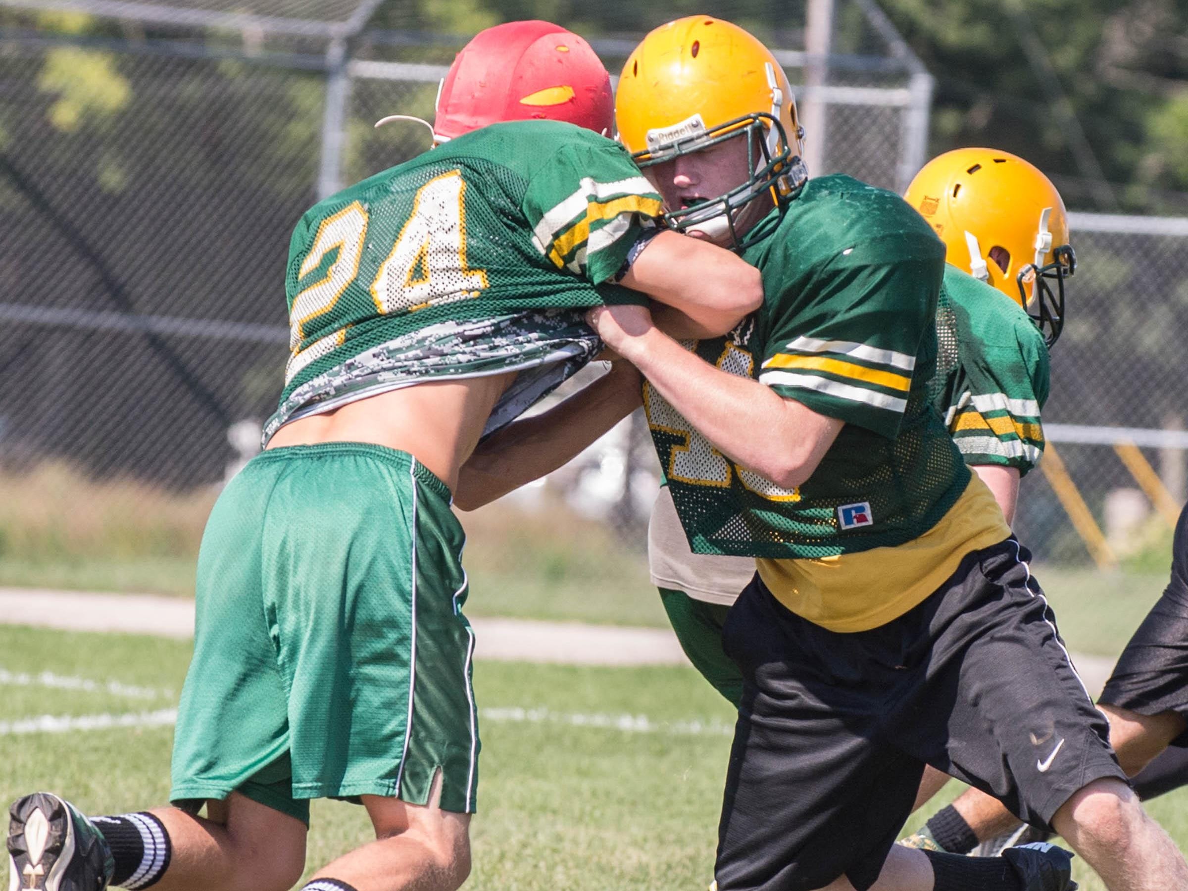 First day of practice with full pads for the Pennfield High School football team.