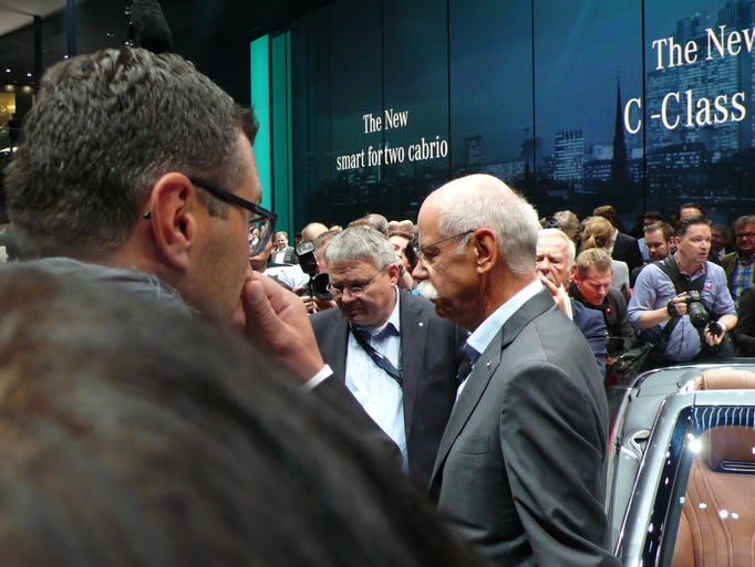 Daimler chief Dieter Zetsche speaks to reporters following