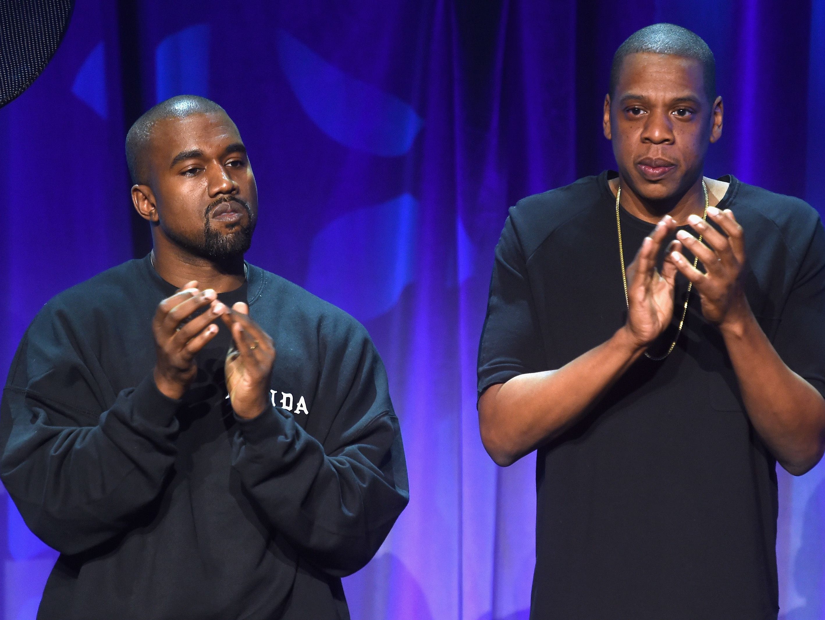 Kanye West (L) and JAY Z onstage at the Tidal launch event #TIDALforALL at Skylight at Moynihan Station on March 30, 2015 in New York City.