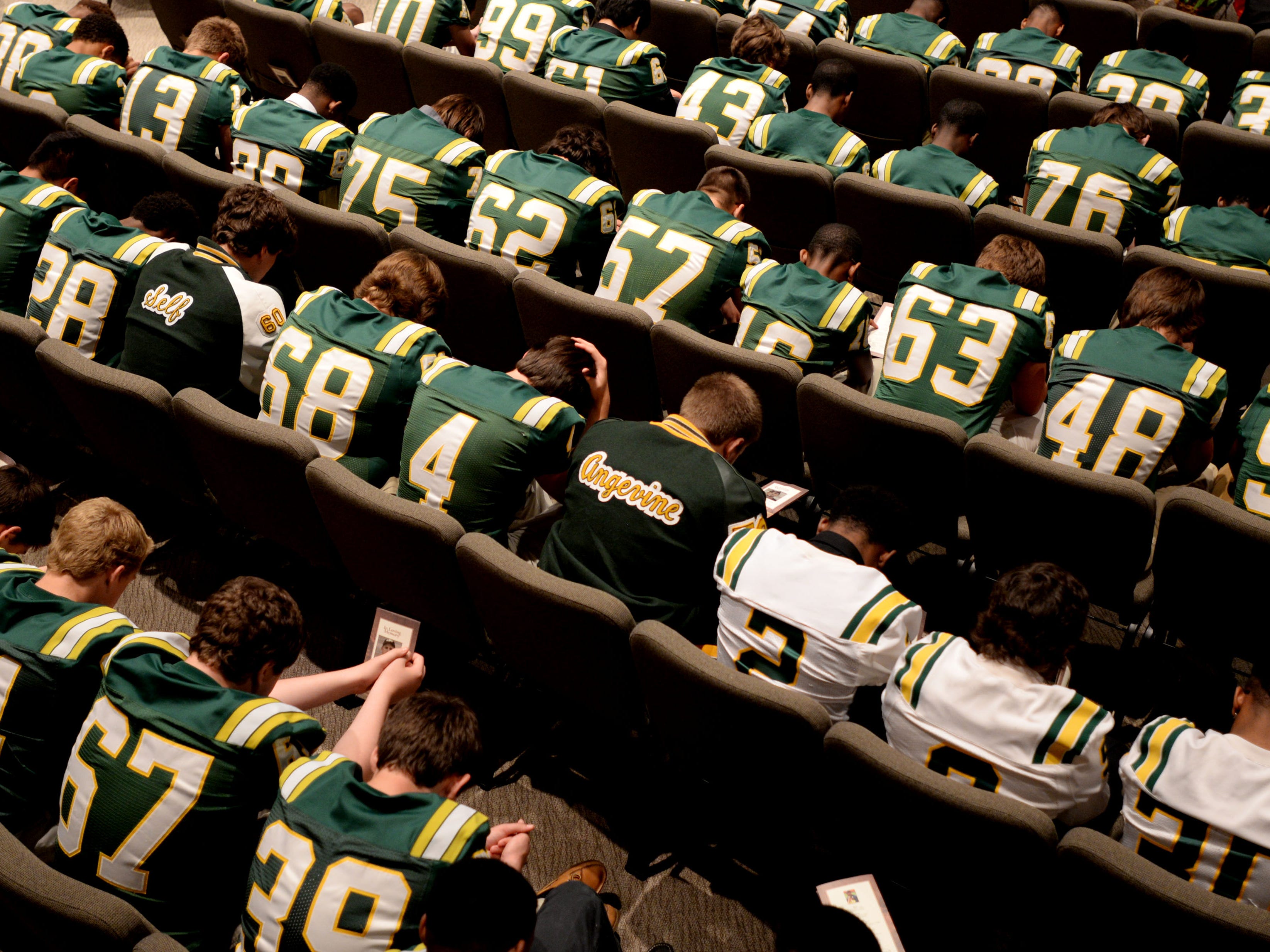 The Captain Shreve football team honors the life of its late coach Richard Lary at Calvary Baptist Church on Wednesday morning.