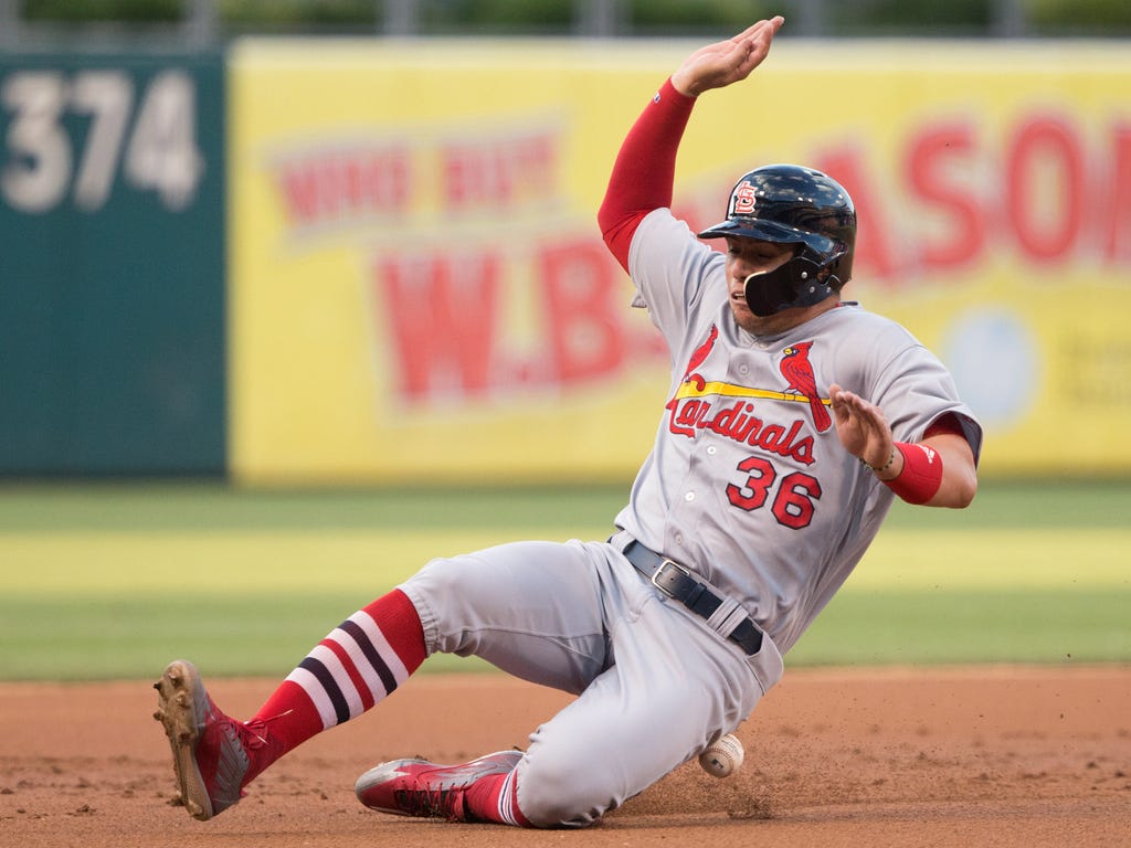 St. Louis Cardinals shortstop Aledmys Diaz  is hit by a ball while advancing to third on a hit by left fielder Tommy Pham during the second inning against the Philadelphia Phillies at Citizens Bank Park in Philadelphia.