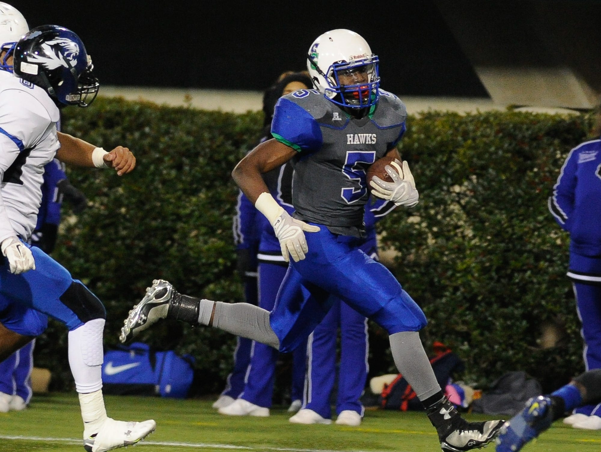 St. George's #5 Angelo Ortiz runs with the ball in the first quarter of the Division II championship against Howard.