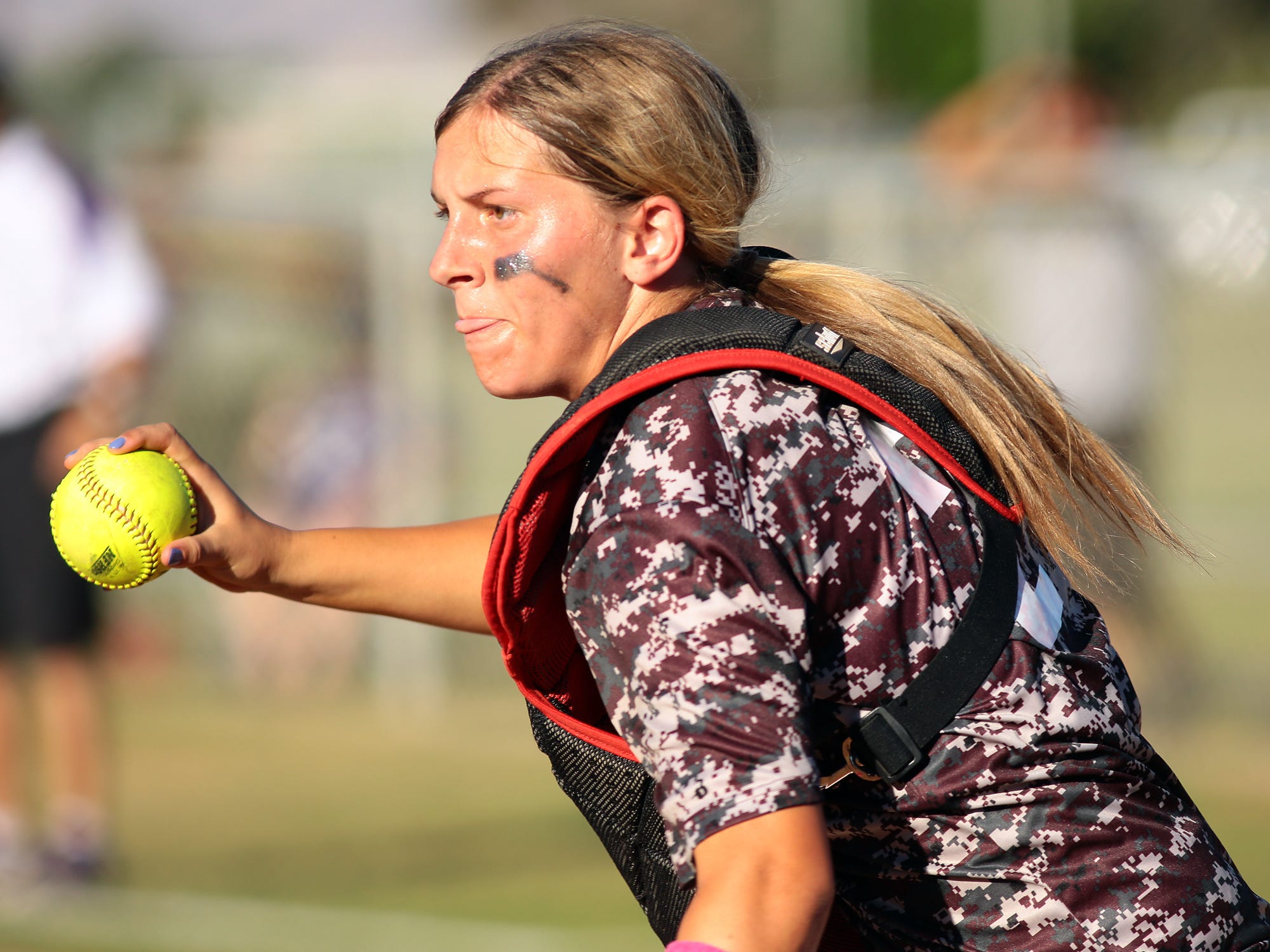 La Quinta catcher Kelli Finan runs up the third base line to make a play against Shadow Hills on Thursday afternoon, March 26, 2015 during a game at La Quinta High School. La Quinta won the first game 7-5 and took another win 4-1.
