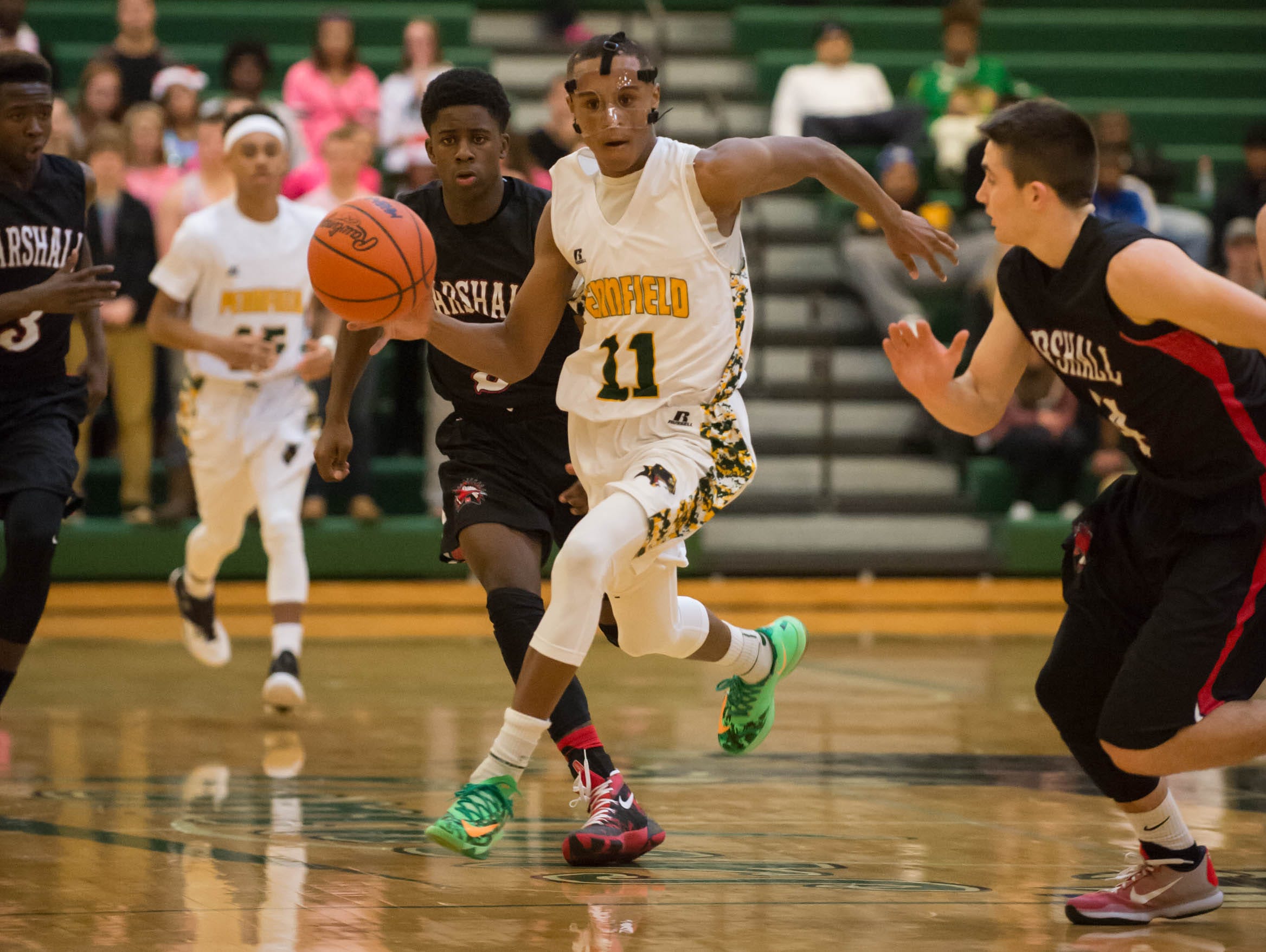 Pennfield's Francois Jamierson (11) bring the ball down the court during Friday night's game.