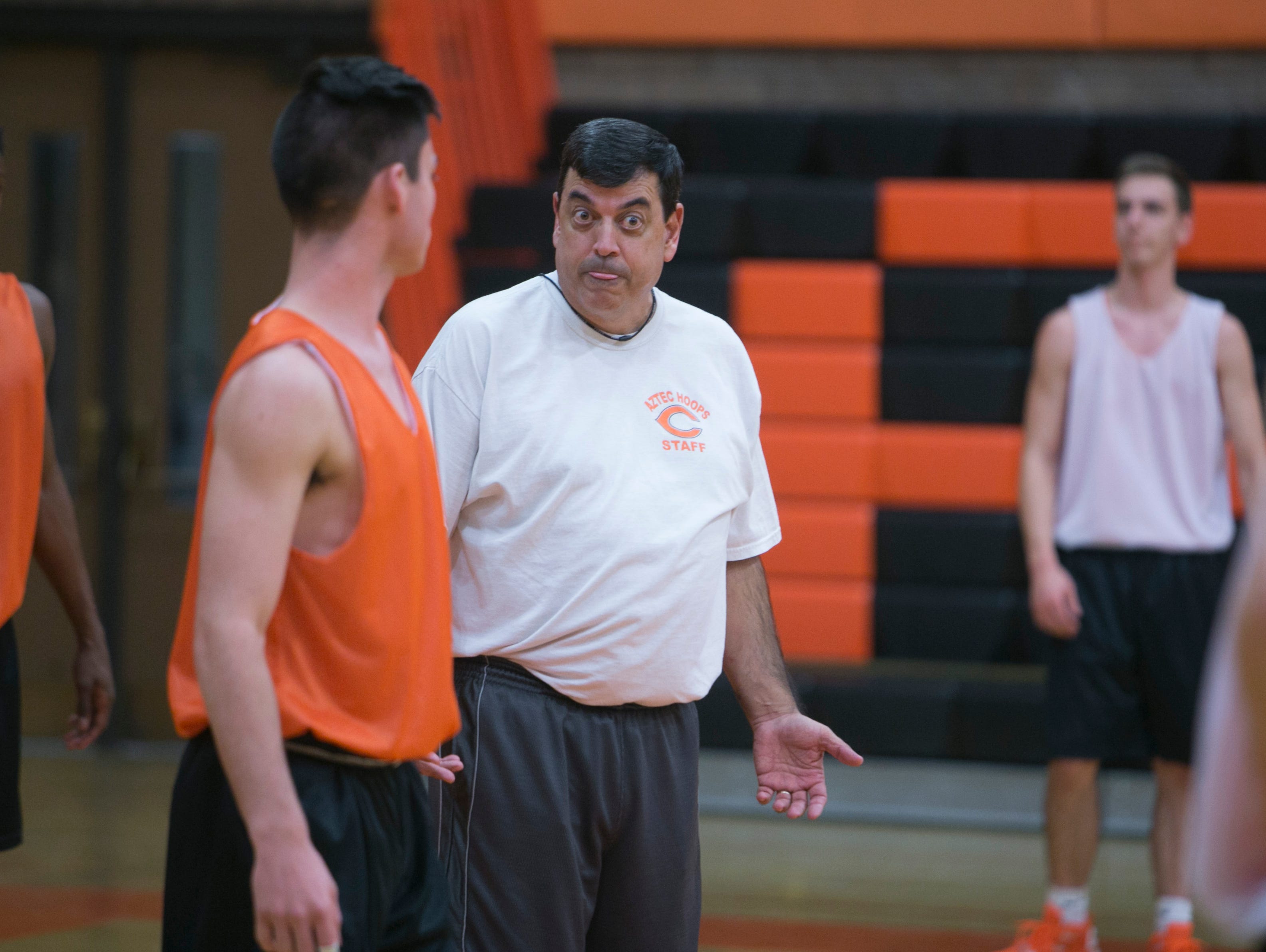 Corona del Sol's coach Neil MacDonald instructs the team during practice at Corona del Sol in Tempe on Nov. 9, 2015.