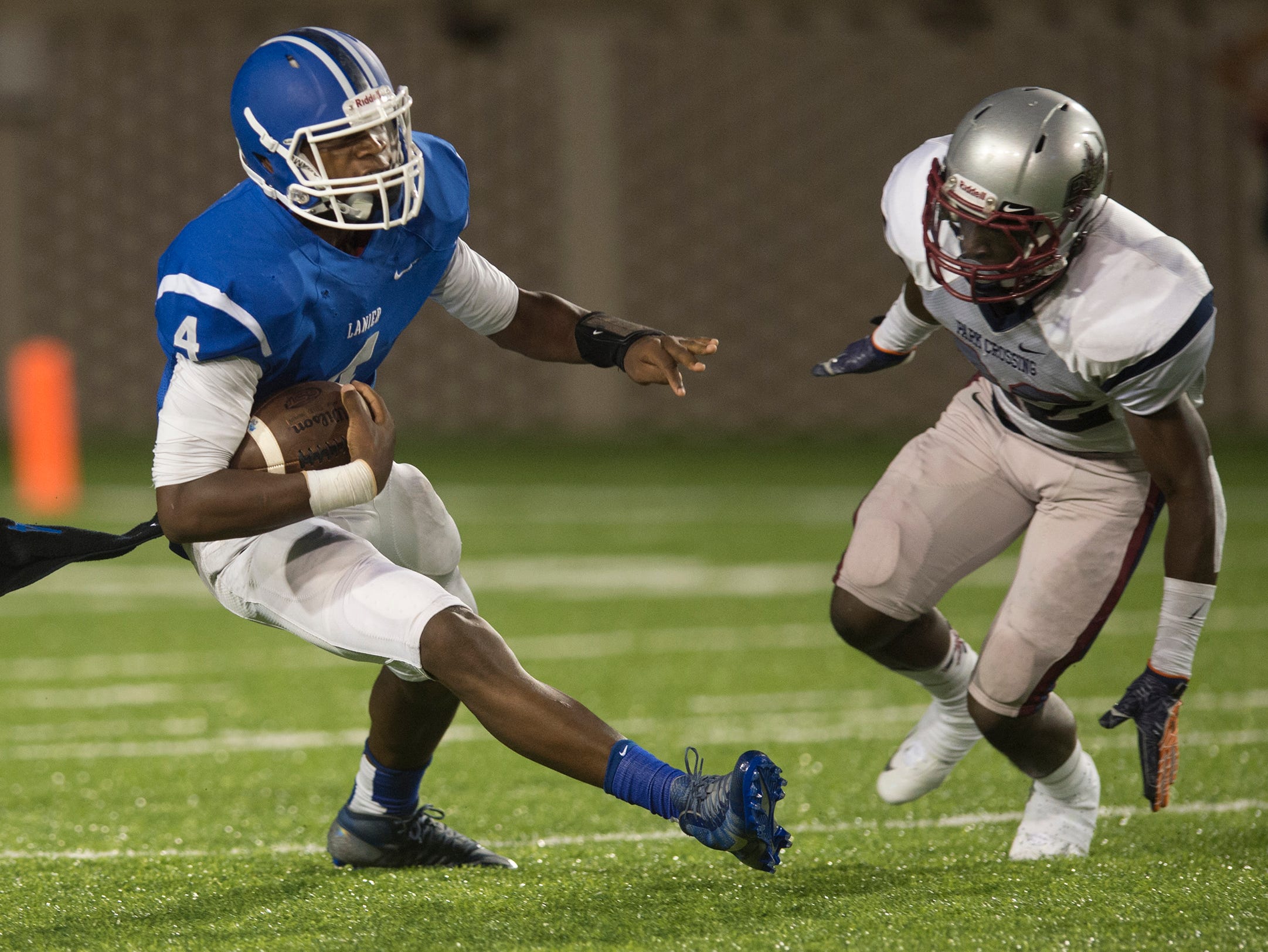 Lanier's James Foster runs with the ball during the AHSAA game between Park Crossing High School and Lanier High School on Friday, Aug. 28, 2015.