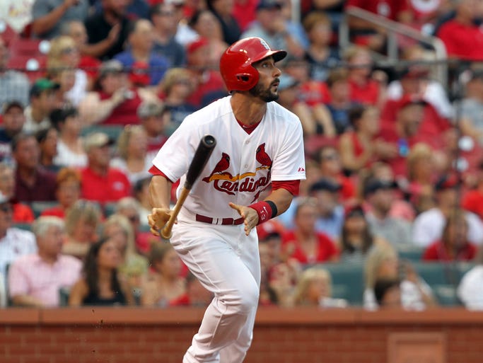 St. Louis Cardinals Matt Carpenter watches his solo home run ball leave Busch Stadium in the first inning against the Tampa Bay Rays in St. Louis on July 22, 2014.