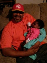 Robert Moore with his now-7-month-old grandaughter