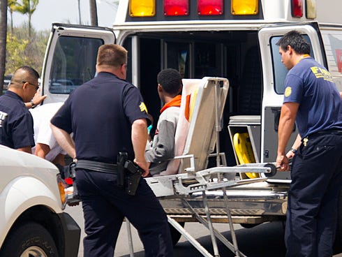 A 16-year-old boy who stowed away in the wheel well of a flight from San Jose, Calif., to Maui, is loaded into an ambulance at Kahului Airport in Kahului, Maui, Hawaii on  April 20, 2014.