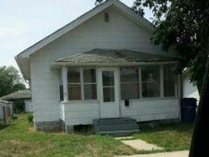 The house where Latoya Ammons lived with her family was on Carolina St. in Gary. This is a photo taken by the police.  A figure appears to show itself in the window at right.