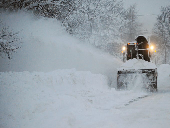 A snowblower clears Broadway street in Lancaster,