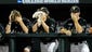 Vanderbilt pitcher Carson Fulmer, center, covers his face with a towel in the dugout during the 6th inning against Virginia at the College World Series at TD Ameritrade Park in Omaha, Neb., Wednesday, June 25, 2014.