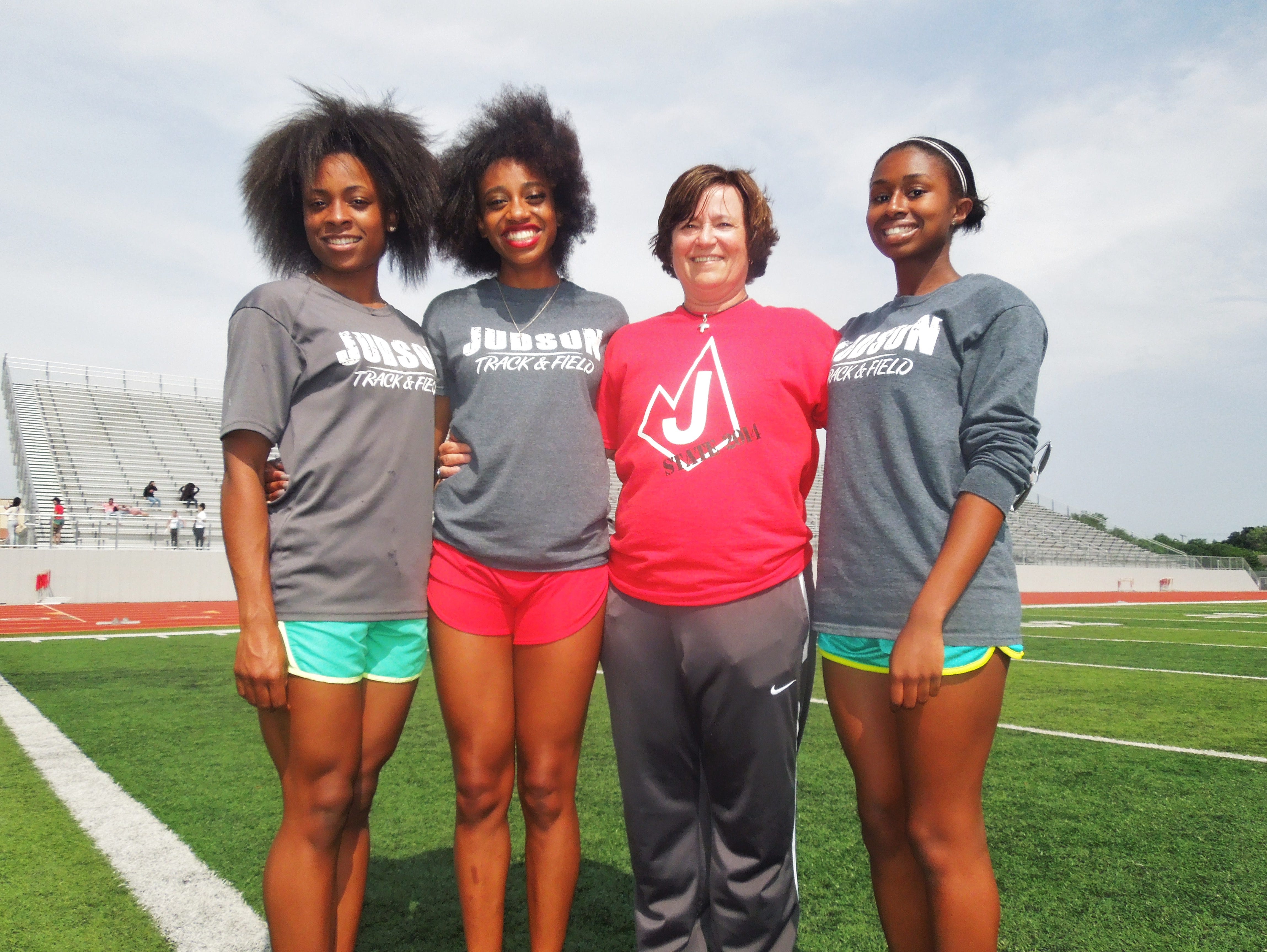 Judson coach Renee Gerbich, pictured with seniors Talajah Murrell, Kiana Horton and Dominique Allen, has led the Rockets to nine regional titles and two state championships in 11 seasons.