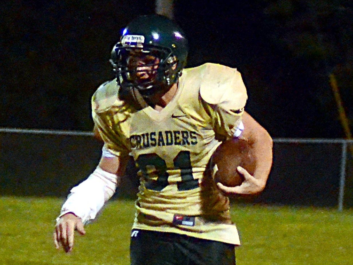 Hendersonville Christian Academy junior Ian Connor carries the football around the left end during a game earlier this season.