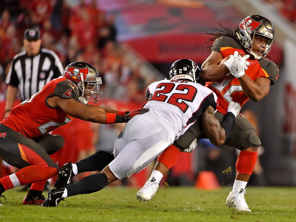 Atlanta Falcons strong safety Keanu Neal brings down Tampa Bay Buccaneers running back Jacquizz Rodgers during the first half at Raymond James Stadium in Tampa.
