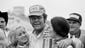 Buddy Baker, Charlotte, N.C. gets a kiss from a couple