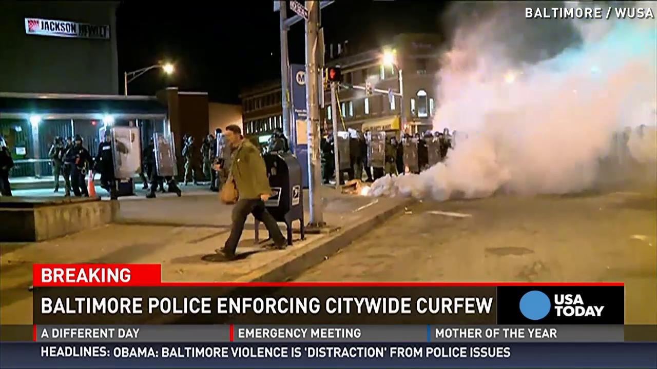 Curfew begins in riot-torn Baltimore